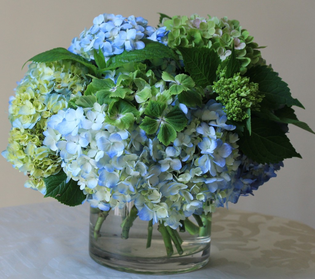 Vase with blue and green flowers