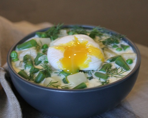 Vegetable Dill Soup with Poached Egg close up