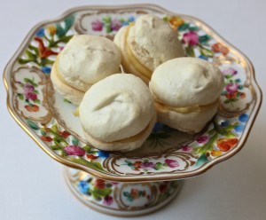 White macarons on colorful dish