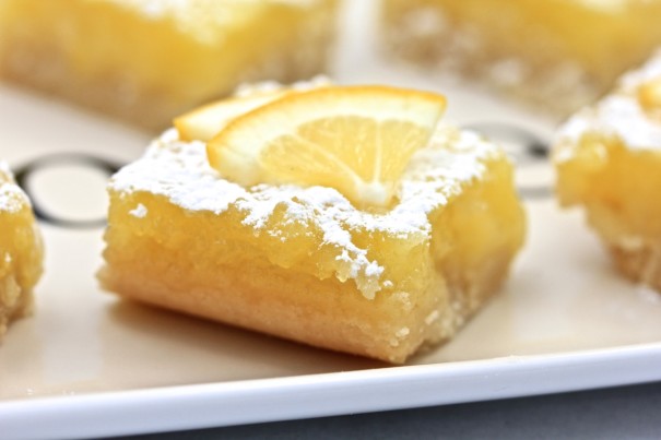 Lemon squares with lemon wedge