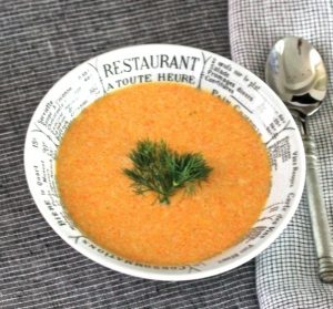 Cream of carrot soup in bowl