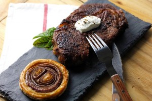 RIBEYE STEAK WITH RED ONION TARTS TATIN AND SOUR CREAM